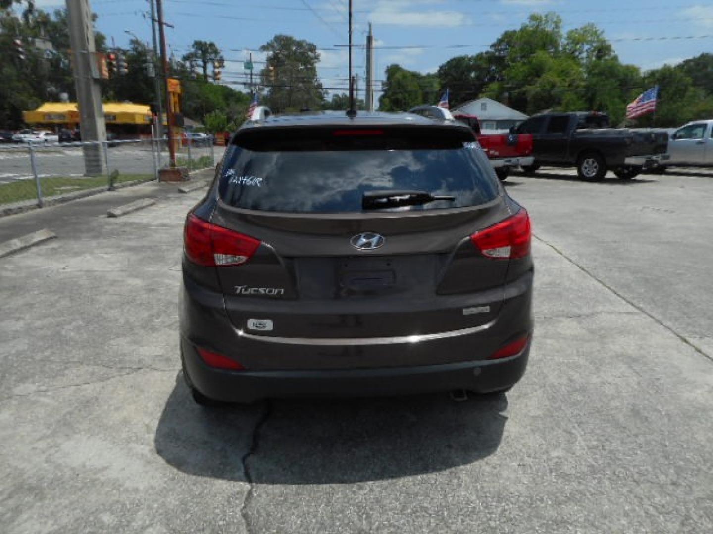 2014 BROWN HYUNDAI TUCSON LIMITED; SE (KM8JU3AG5EU) , located at 1200 Cassat Avenue, Jacksonville, FL, 32205, (904) 695-1885, 30.302404, -81.731033 - Photo#5